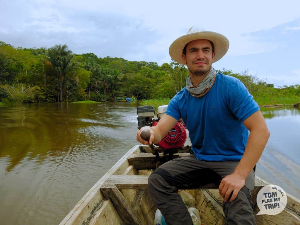 Adrien driving a boat - Palmari natural reserve - Amazon - Colombia