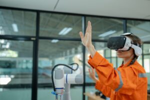 Engineer are using virtual AR to maintain of human robot and CNC machine at the 4.0 Smart Factory.