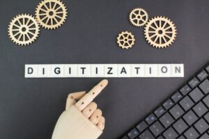 gear teeth and laptop keyboard with the word digitization.