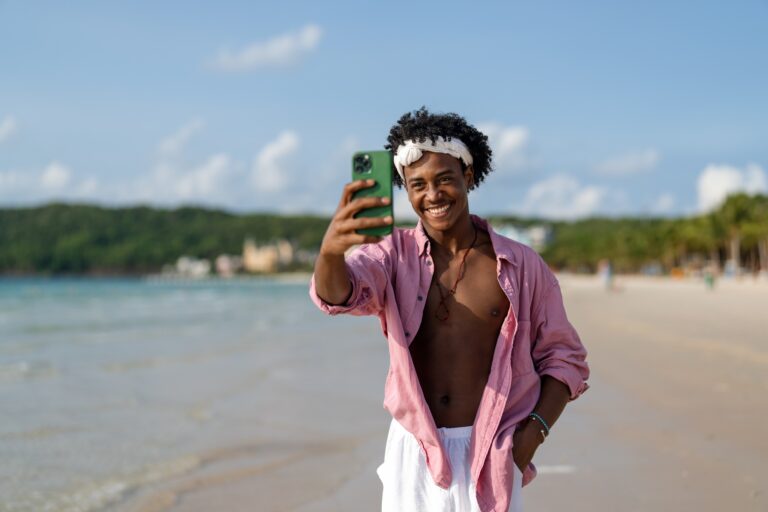 Influencer taking a selfie on a tropical beach, enjoying vacation, social media content creation
