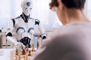 Strategic battle: boy and robot play chess